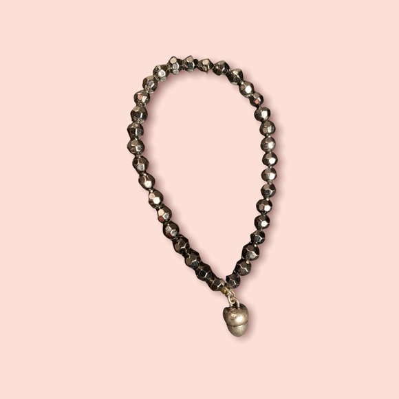 Black bracelet with metal piece hanging - Picture 2 of 5